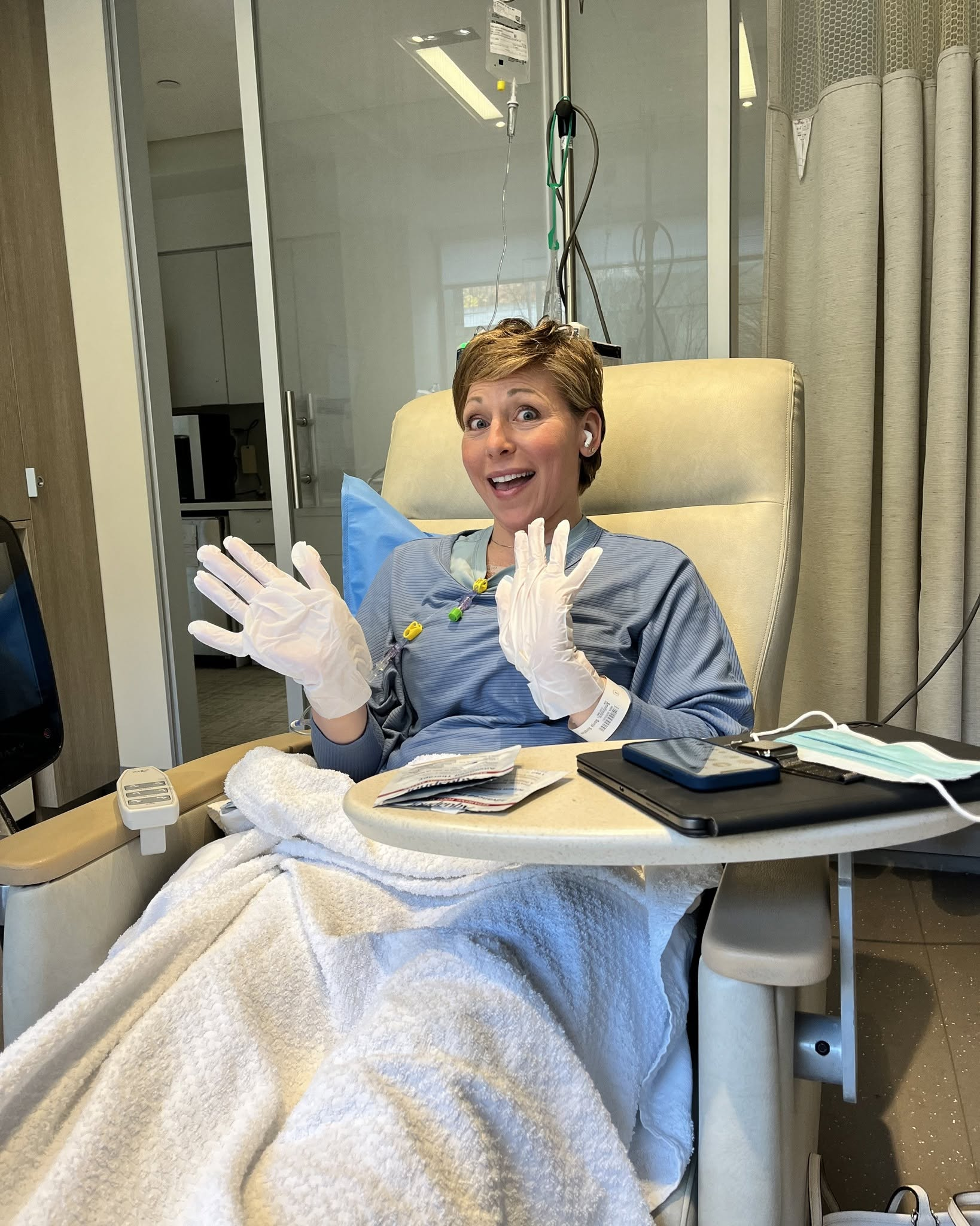 Jane Kennedy seated in a medical treatment chair ahead of scheduled testing for a personalized mRNA cancer vaccine