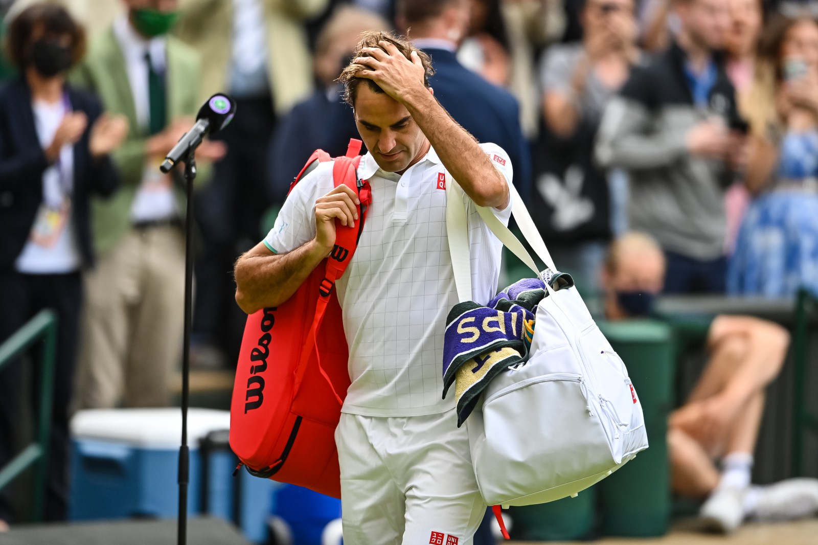 Roger Federer walking off Centre Court at Wimbledon in 2021