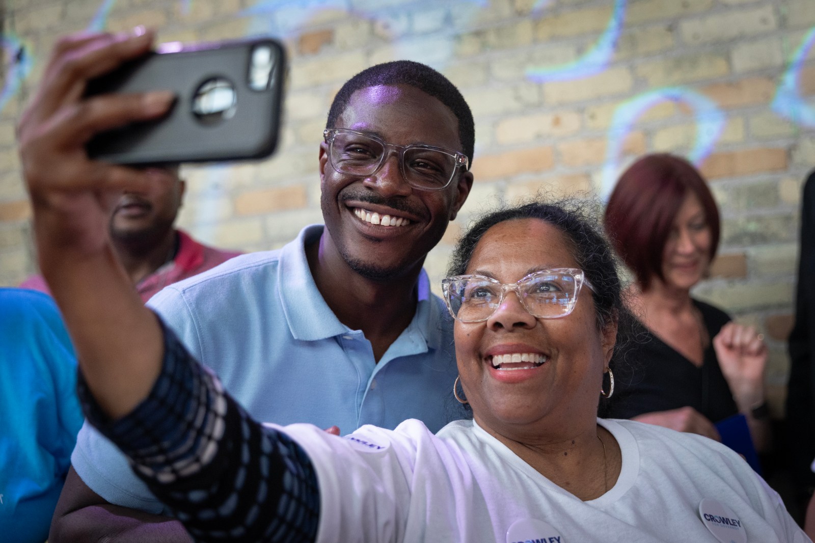 David Crowley taking a selfie with a supporter in Milwaukee