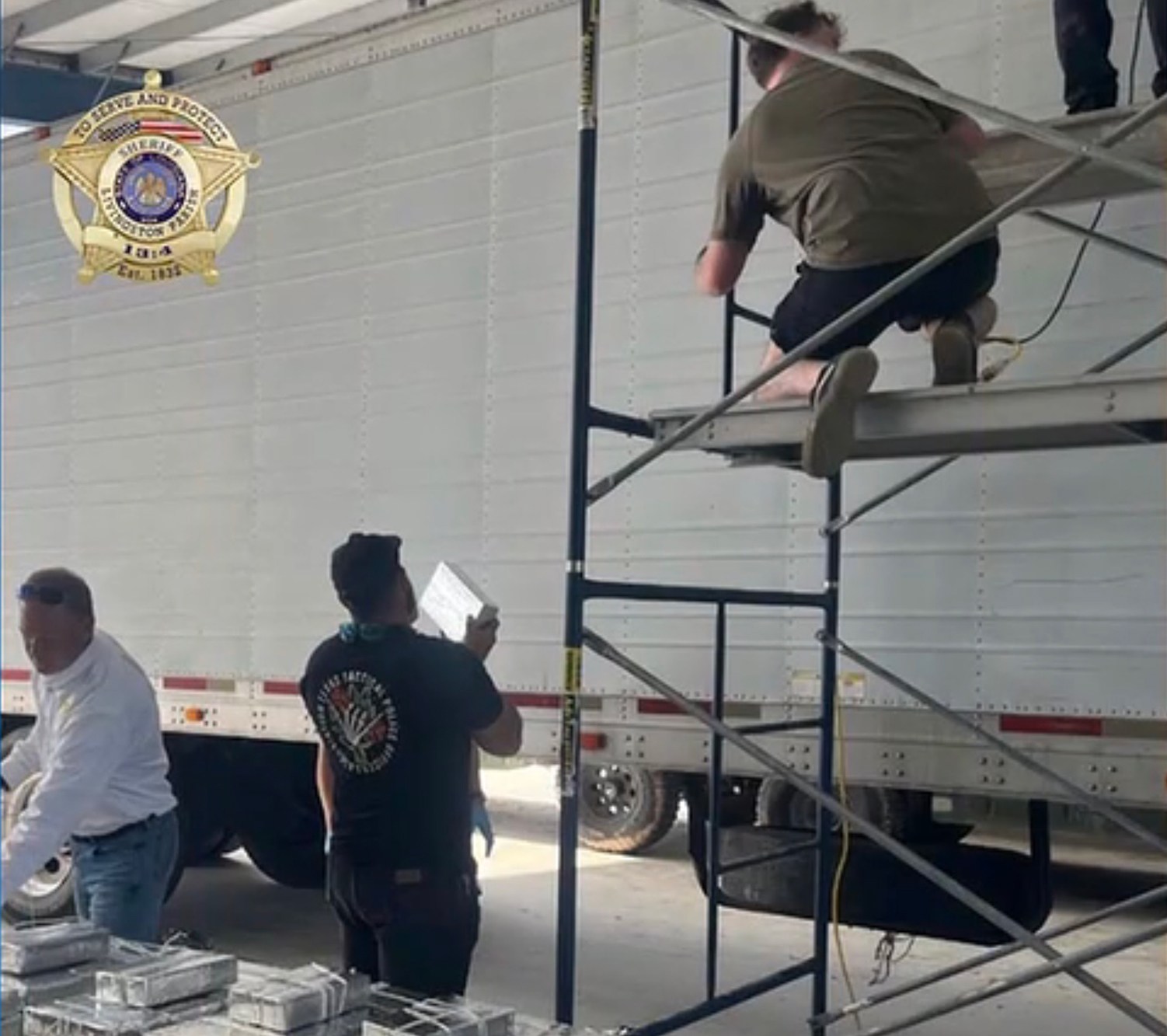 Investigators inspecting a semi-truck during the Louisiana methamphetamine seizure