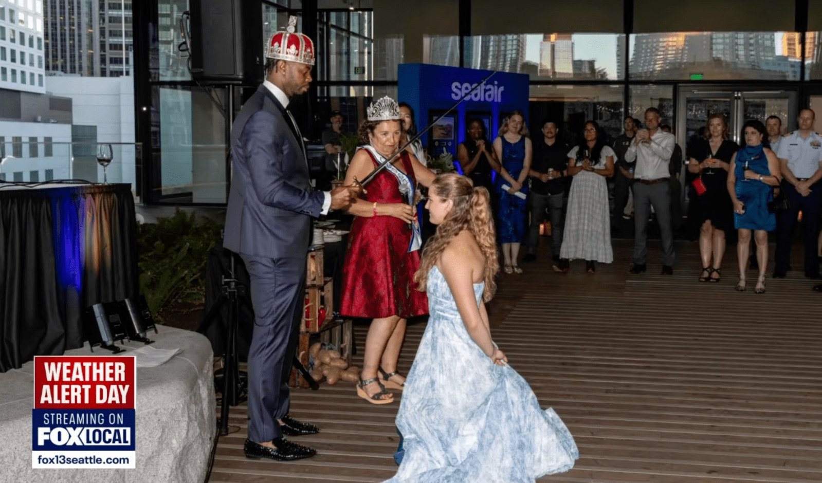 Lillie Vehling being knighted into the Seafair royal court